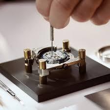 A man is dismantling the watch