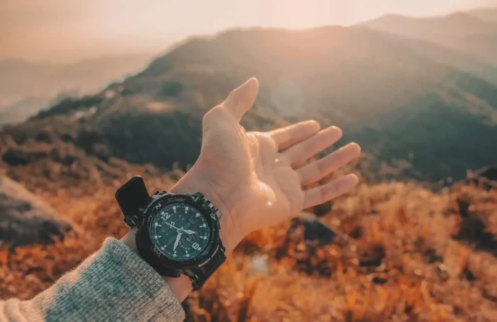 a boy wearing a black watch